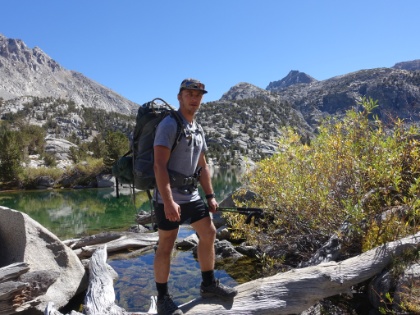 Dustin crossing the stream that joins the two halves of Rae Lake.