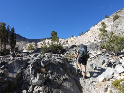 Dustin making his way up the rocky terrain. Our plan to get over the pass first thing in the morning seems to be paying off as our energy is high and we're making good time.