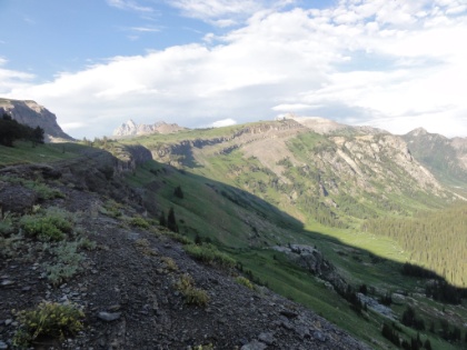 An early evening view of the shelf, the canyon below, and the Grand Teton in the distance.
