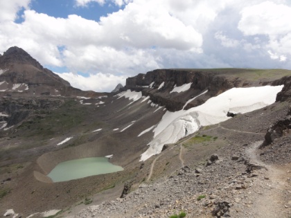 Heading down into Cascade Canyon. This is  Schoolroom Glacier and the proglacial lake that has formed from its runoff. Notice the groove cut in the talus where the lake empties into the valley below. The glacier is named Schoolroom because it exhibits all the textbook signs of a glacier. Unfortunately, the glacier has been retreating for years and is expected to be entirely gone by 2030.