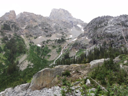 Fortunately, the storm broke for a while and I was able to keep pressing on through the camp zone. The trail was steep downhill and I was making great time, but I was also running out of camp zone. There were only a few sites left, and one of them was already occupied. If the last couple were also full, I would have to backtrack uphill at least a mile back into the zone to return to the open sites I had already passed.