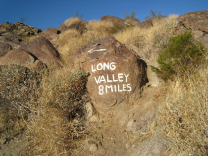 One of the famous rock signs. 8 miles to the Long Valley tram.