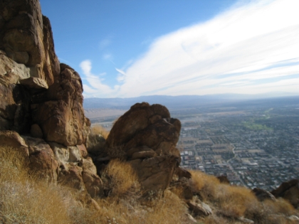 Rock formation with Palm Springs in the distance.
