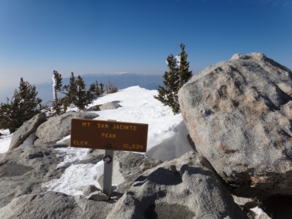 Made it!  Only person on top. I love the little arrow in case you didn't realize that rock to the right was the highest point. It's just before 5:00pm when I officially summit. Definitely my latest summit ever, but fortunately I get to take the tram most of the way down.