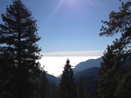 A sea of clouds in the valley below.