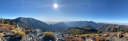Panorama from the top of Pine Mountain. Mt Baldy, West Baldy, Iron Mountain, and Mt Baden-Powell from left-to-right, with the ocean in the distance.