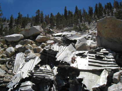 The remains of a military aircraft that crashed into the side of the mountain in 1953. There is wreckage strewn down the slope for several hundred feet.