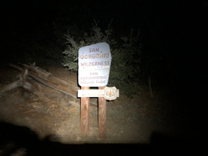 The headlamp went on around 8:00pm. This sign means I'm finally getting close to the trailhead!