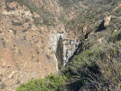 The view of the falls actually disappears for a little while, which is disheartening. But finally it comes back in full force. I believe this is the spot where others had stopped recently. So close to a full view, but not quite. The rough use trail ends here, and then becomes a complete free-for-all straight down the side of the canyon. But I can't stop so close! The next section was definitely one of the gnarliest adventures I've been on in a while.