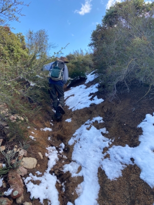 Heading up some steep, rutted trail.