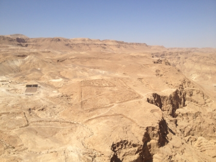 After the Jews fled Jerusalem in 70 CE, they settled at Masada. In 73 CE, the Romans laid seige to Masada to eliminate the last of the Jews. They encircled the entire mountain with a wall, which you can still see portions of here. They built multiple seige camps around the mountain. Here you can still clearly see the remains of the squared walls around one of the camps.