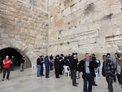 The Western Wall (or Kotel). Though most commonly known as the "Wailing Wall", that term seems to be somewhat deragotory among Jews, and it is only referred to as the Western Wall here. Temple Mount is the holiest place on earth for Jews, but it is now contained in the Muslim quarter.  This is the western wall of the old Temple Mount courtyard, now the closest that Jews can get to their holiest place. After the 6 day war in 1967, the Moroccan Quarter was destroyed in order to give easier acess to the wall.