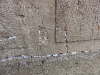 The ultimate version of throwing pennies in a fountain. Jews write their wishes on pieces of paper and embed them in cracks in the wall. The theory being that the closer they are to the holy Temple Mount, the better the odds of them being granted.