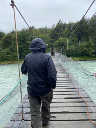 Dad taking the rickety suspension bridge over the Rio Grey.