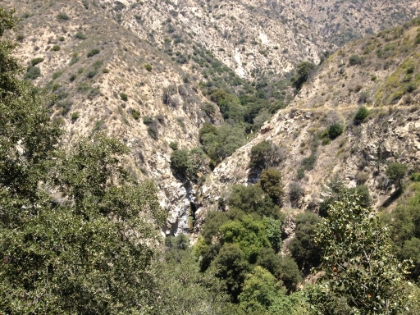 Back onto the maintained section of trail looking back at the crevice where Millard Falls would be in a wet year.
