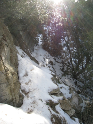 Yes, that is the trail. And no, I am not able to run through this section. This is a slow hike on a narrow snow covered ledge with a steep dropoff to your right. Awesome!
