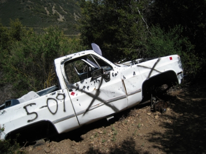 I'm not quite sure how this truck got there, but it looks like it's been there for a while. I'm guessing the trail must have been wider at some point.