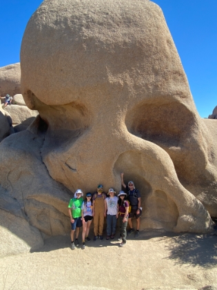 The whole gang posing in front of Skull Rock.