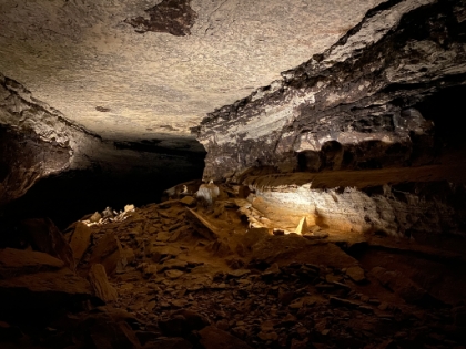 Continuing through the main entrance hall. The upper portion of the cave was used for mining gun powder during the Civil War. The shelf on the right is called Giant's Coffin.