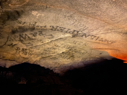 Cave graffiti dating back hundreds of years. It was written using candle smoke. Graffiti is now a federal offense here, but they leave the old graffiti for historic value.