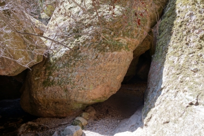 Entrance to the cave. It's not a traditional underground cave but is instead a talus cave formed by large boulders that have fallen from the cliffs above.