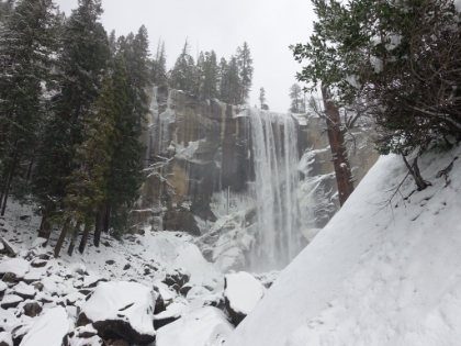 The first full height view of Vernal Fall. Despite being early winter, there's as much or more water than in a dry summer. I know I should definitely be turning around here since my Dad is waiting and the trail is getting increasingly steep and slippery. But I can get an even better view if I go just a little bit further...