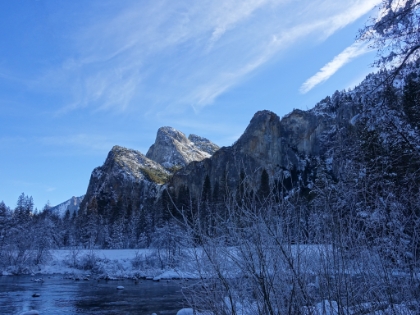 Bridalveil Fall and the Cathedral Rocks above the meadows and Merced.
